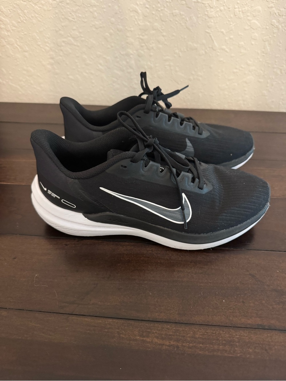 Nike women’s Black Running Shoes with White Swoosh
